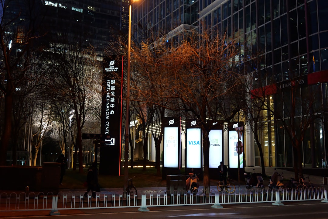 Australian dollar coins and RBA building, symbolizing Australia's monetary policy challenges.