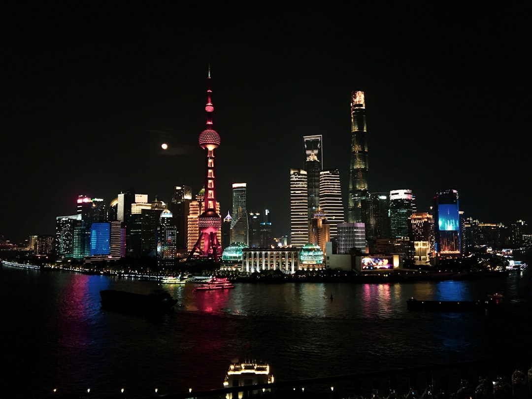 Bitcoin and Ether symbols on a digital background showing price charts