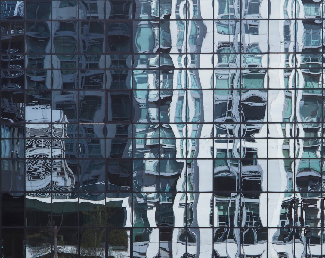 Chart showing downward trend in Canada New Housing Price Index with Canadian flag in background