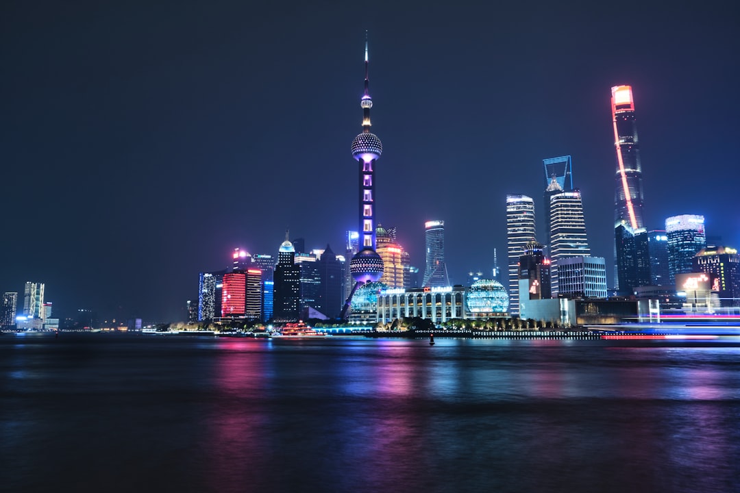 Cardano (ADA) cryptocurrency logo amidst a backdrop of fluctuating market charts, representing macro and liquidity dynamics.