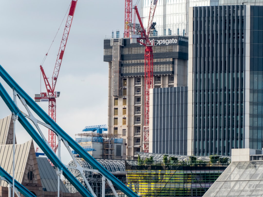 Oil derricks silhouetted against a dramatic sunset, symbolizing geopolitical tensions affecting crude oil prices
