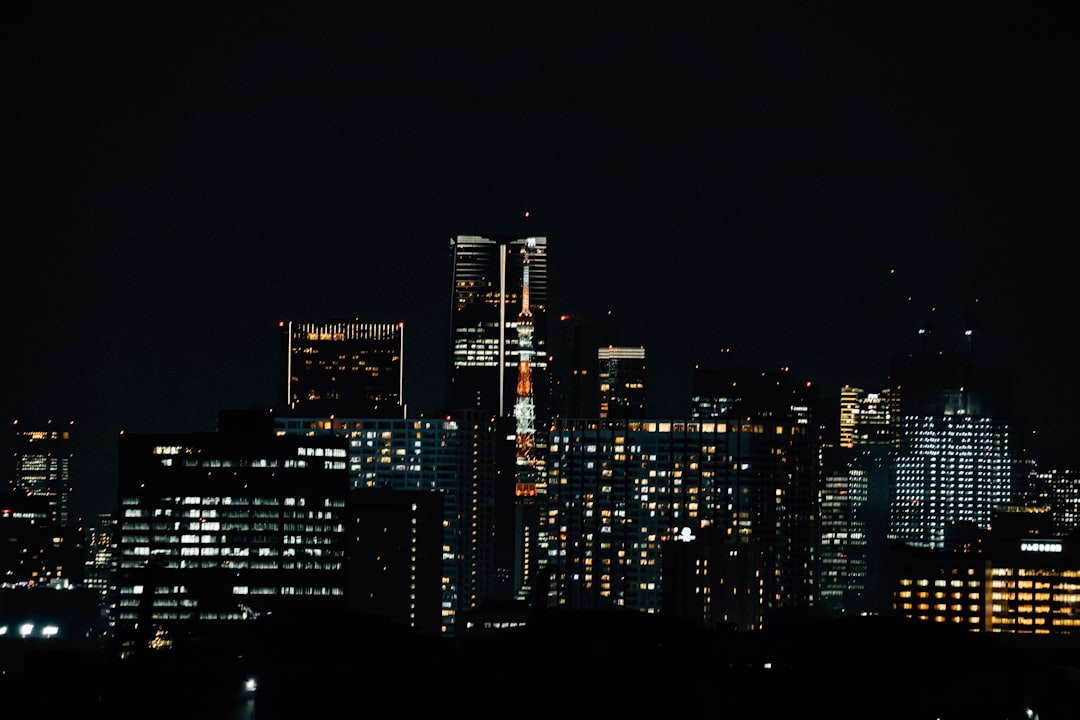 Power lines and a substation set against a backdrop of a global map, symbolizing energy infrastructure risk and geopolitical tensions.