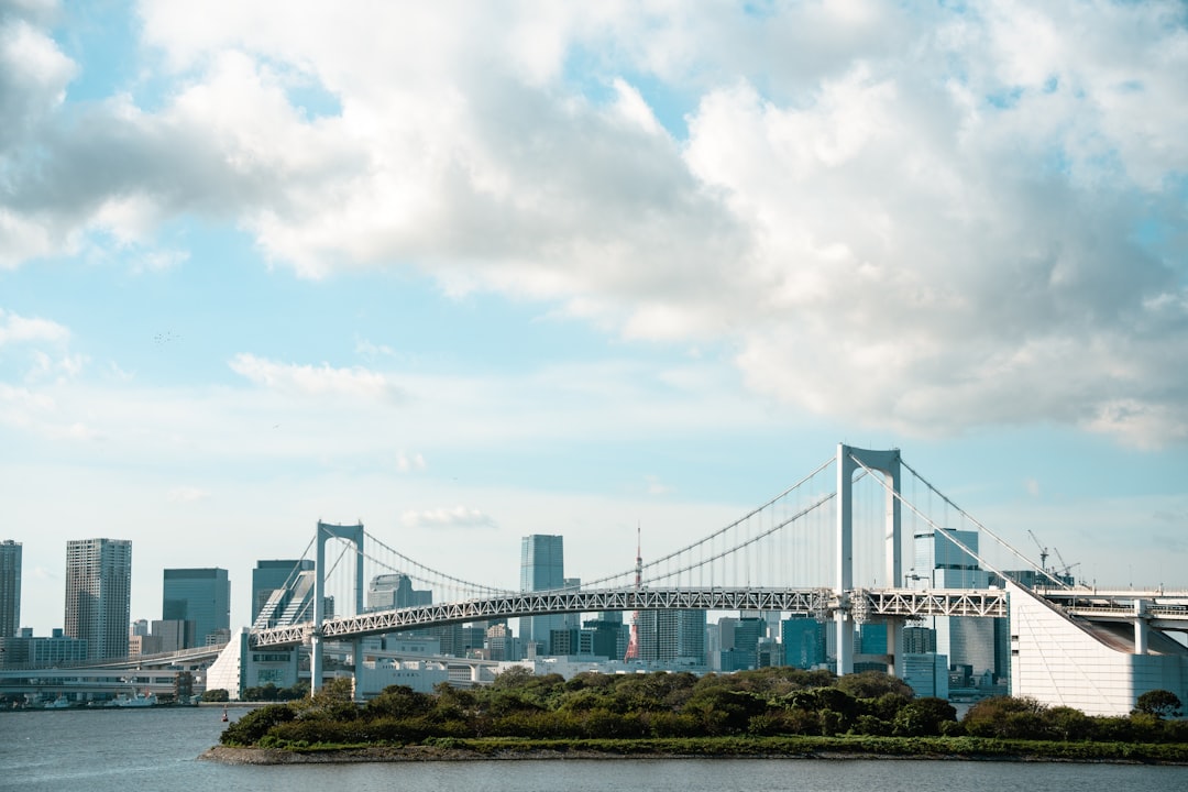 Geopolitical map with power grid symbols and financial market charts, illustrating the impact of global events on energy and finance.