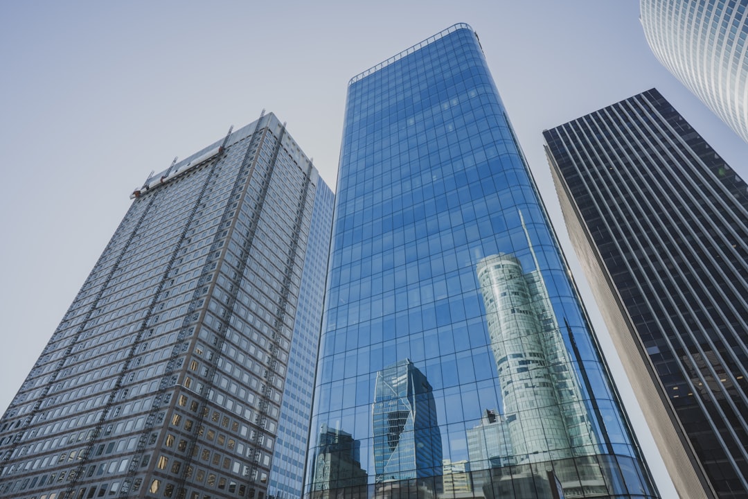 Global Dollar (USDG) stablecoin icon with a background of various cryptocurrency charts, symbolizing stability amidst volatility.