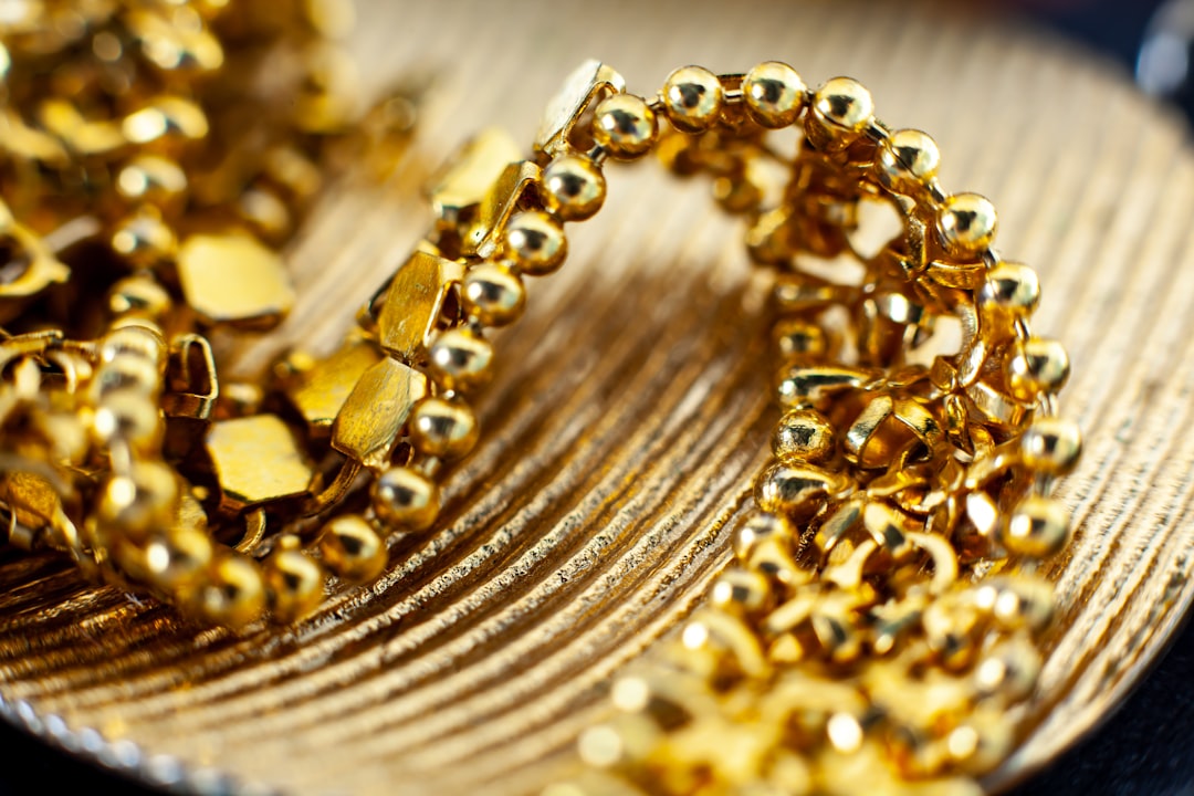 Gold bars and financial charts representing the XAU/USD price surge