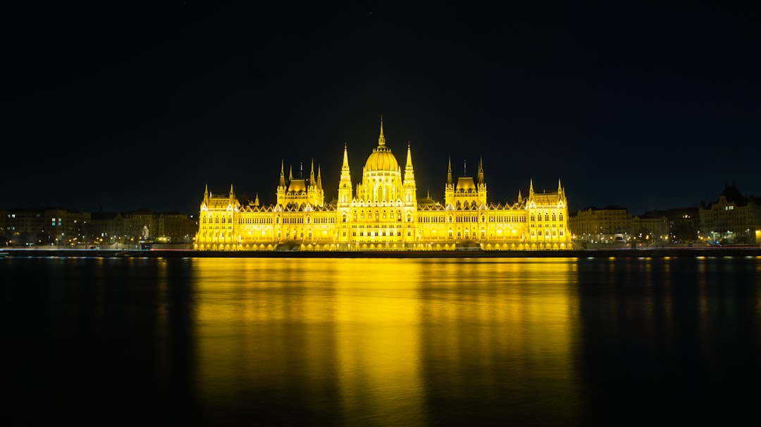 Hedera Hashgraph (HBAR) logo illuminated against a backdrop of digital charts, representing blockchain technology and market analysis amidst recent developments.