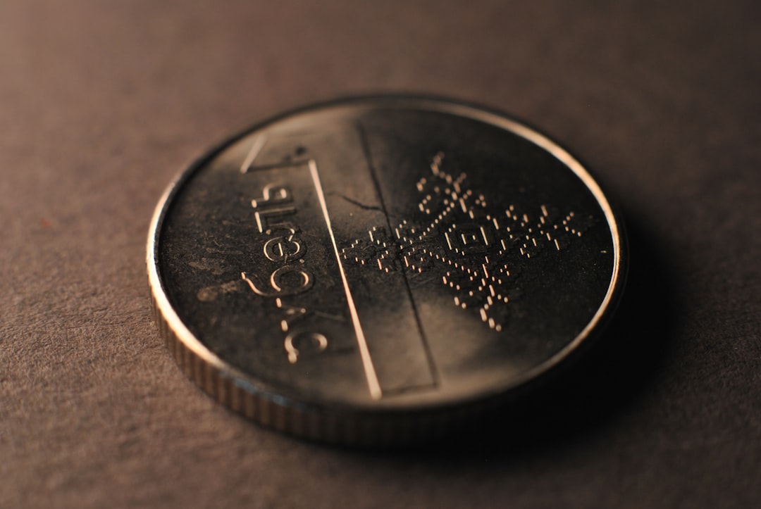 Abstract representation of financial markets with upward and downward trends, overlaid with currency symbols, commodity charts, and AI-related imagery, reflecting the complex interplay of inflation, rates, and geopolitics.