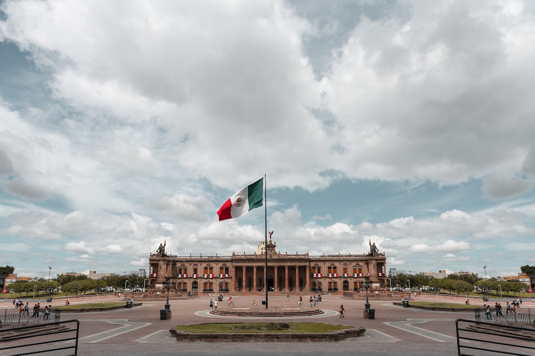 Mexican peso chart against a backdrop of economic data representing GDP growth.