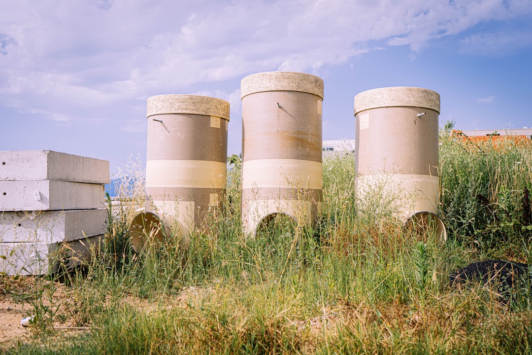Natural Gas pipelines against a blue sky, symbolizing energy flow and price dynamics.