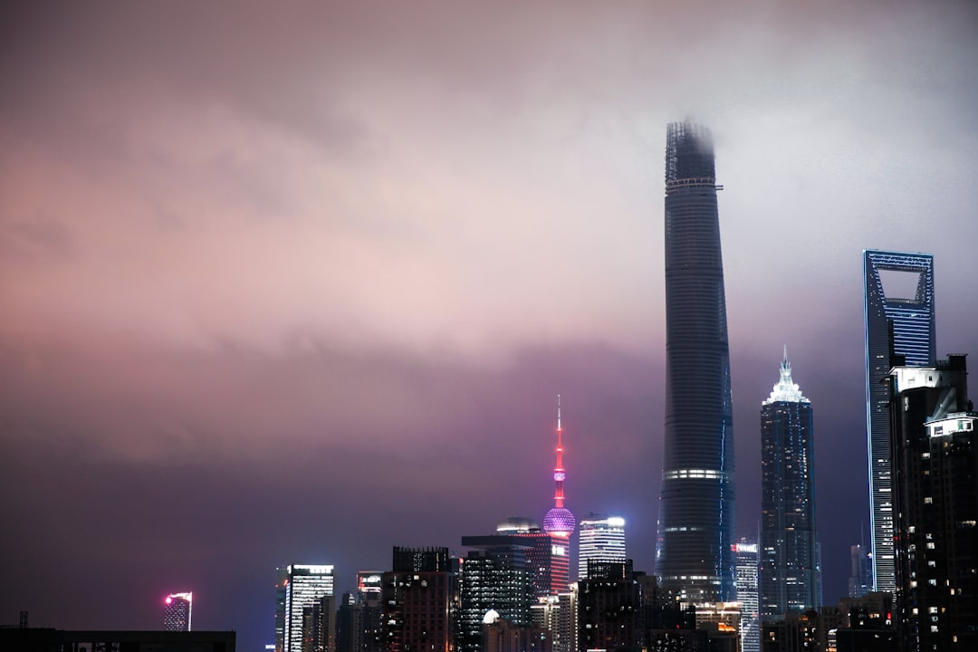 Pepe (PEPE) cryptocurrency logo against a dynamic background of market charts, symbolizing volatility and macro influences.