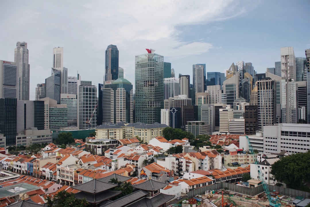 Singapore skyline with trading charts overlaid, representing Straits Times Index (STI) analysis and market consolidation.