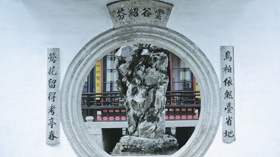 Soybean field with harvest machinery approaching under a clear sky