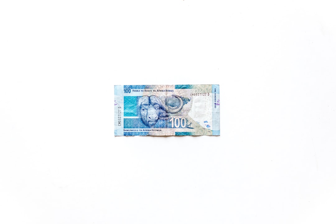 Turkish Lira banknotes and an inflation graph, symbolizing economic uncertainty and currency stability efforts.