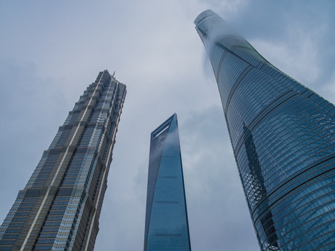 UMA cryptocurrency symbol against a backdrop of financial market charts, illustrating volatility and analysis.