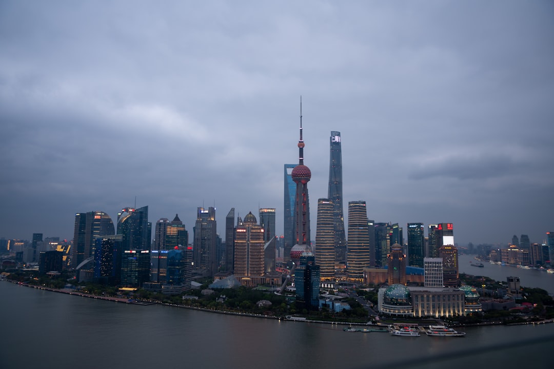 Abstract visualization of interconnected global risks: critical minerals, energy networks, and digital dataflows representing AI funding, with a highlighting overlay on 'underpriced risk'.