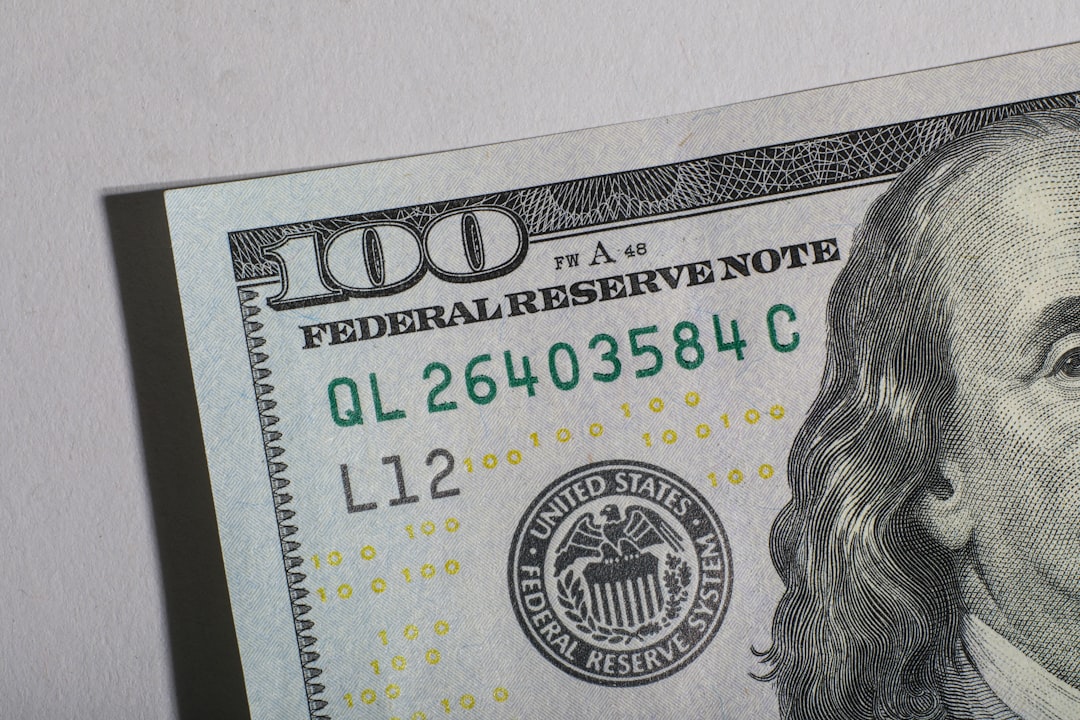 US Federal Reserve building with US currency and stock market charts, symbolizing policy influence on markets