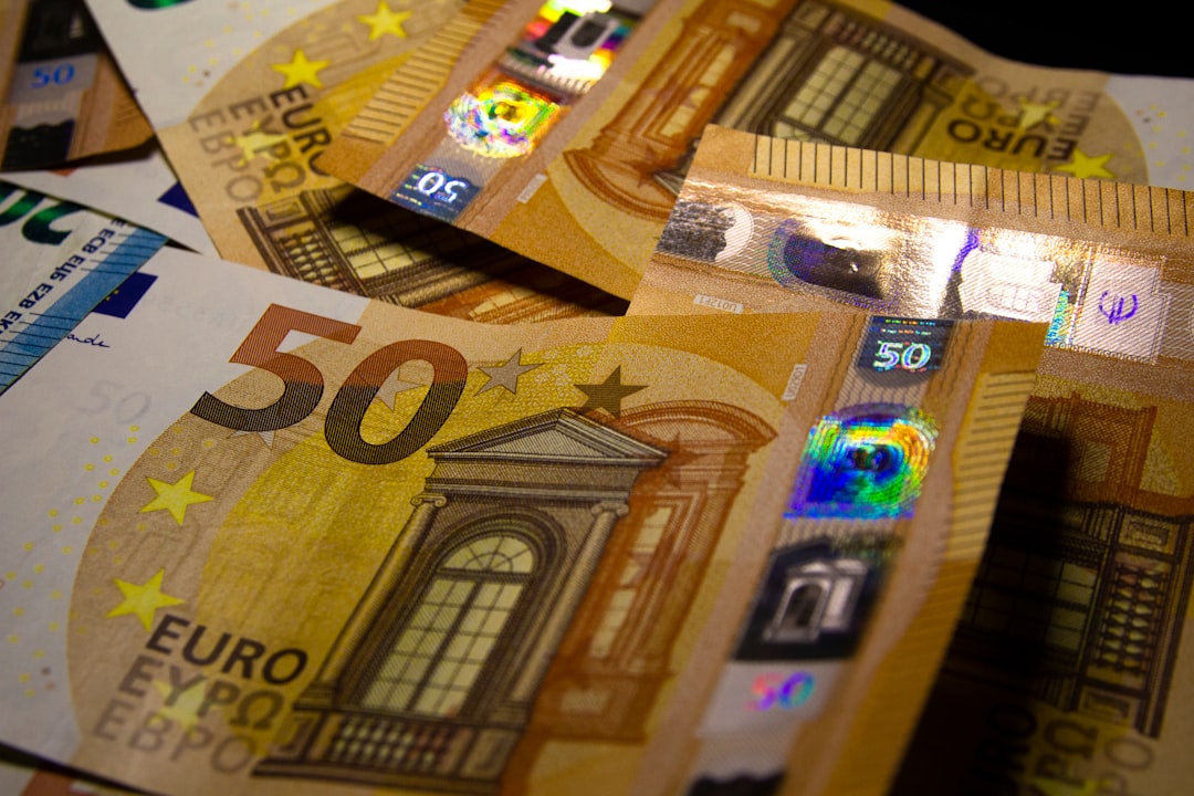a pile of 50 euro bills sitting on top of each other