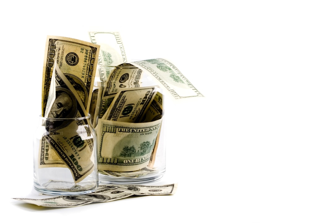 MRSH Q4 earnings: Money in glass symbolizes consulting demand and margins strategy.