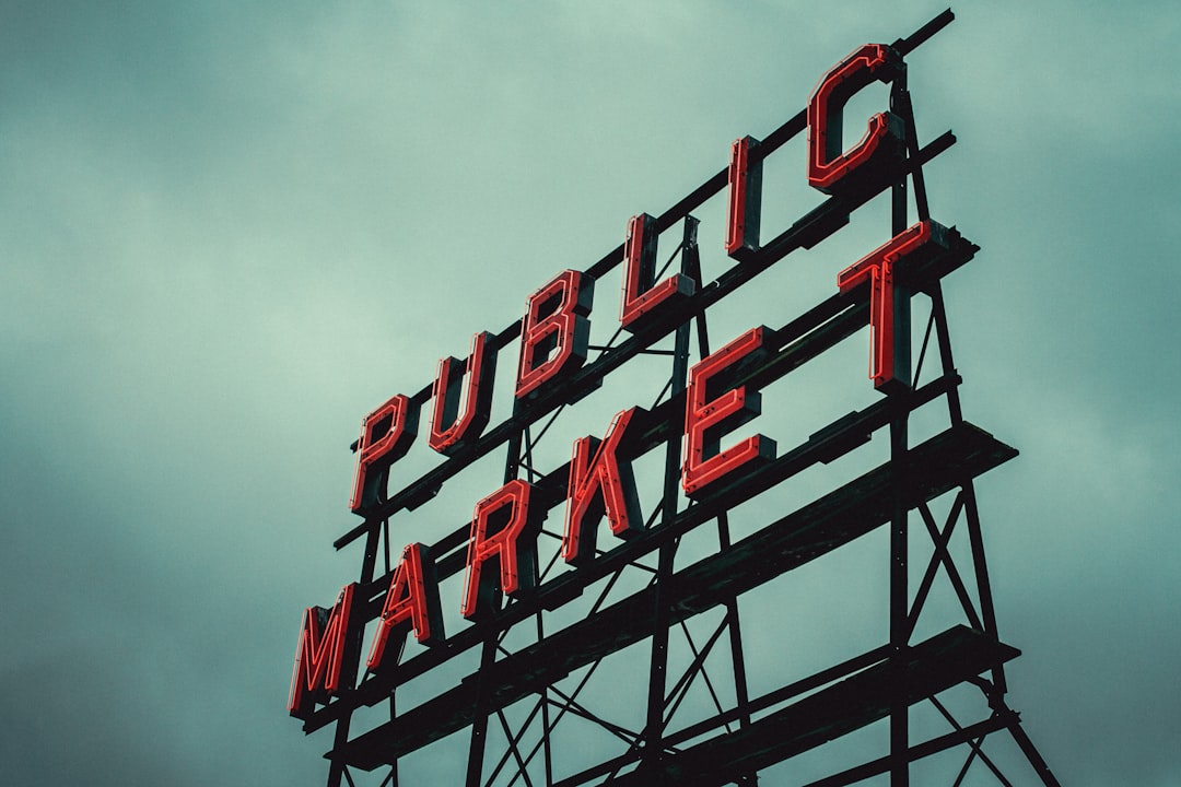 Red & white Kanji signage hints at global AI infrastructure capex, private vs public bonds.