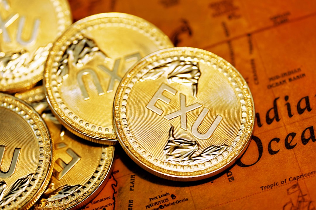 金幣置於棕色織物上，象徵USD/KRW穩定與1473.58美元利率。