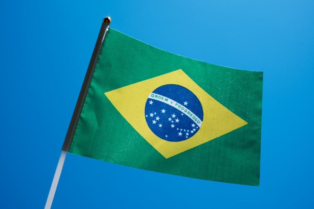 Brazil flag in blue sky, IBOVESPA index nearing 165,411 support