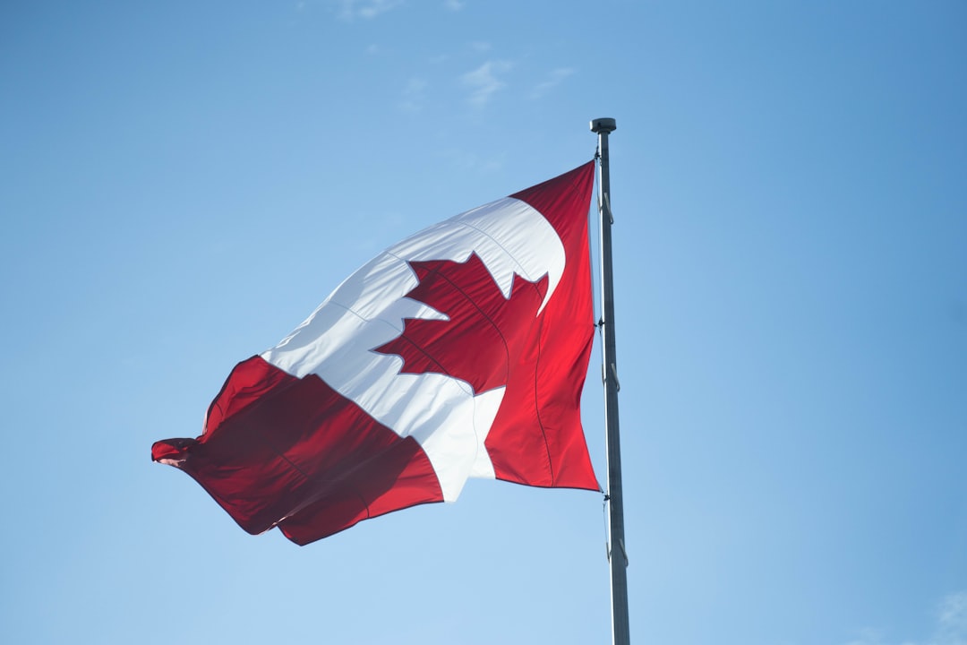 Canadian flag against sky, economic news Canada CPI rises