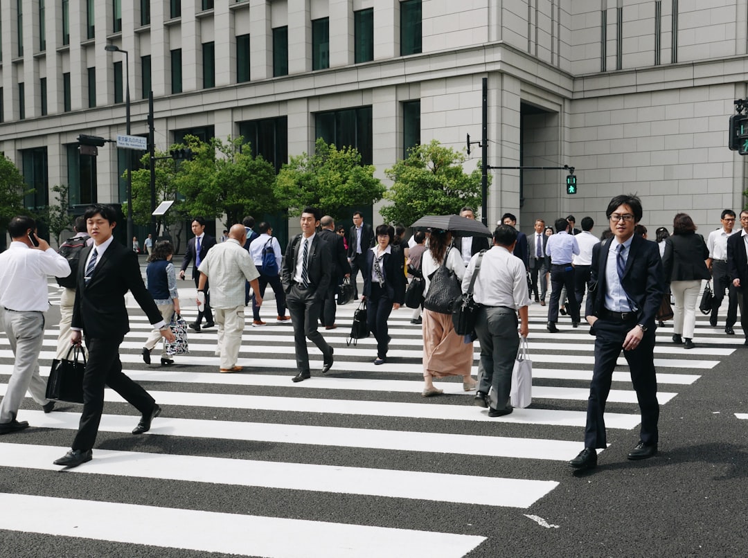Japan pedestrians, Tokyo crossing, BoJ policy focus, CPI easing impact
