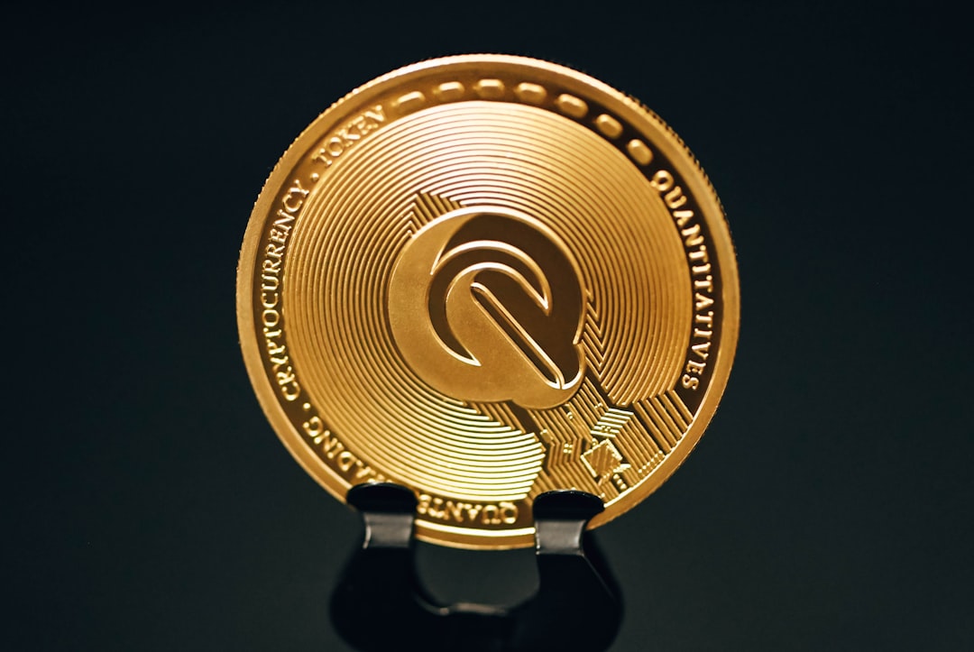Gold QUQ coin pivots at $0.0022 on black surface, Quq market update