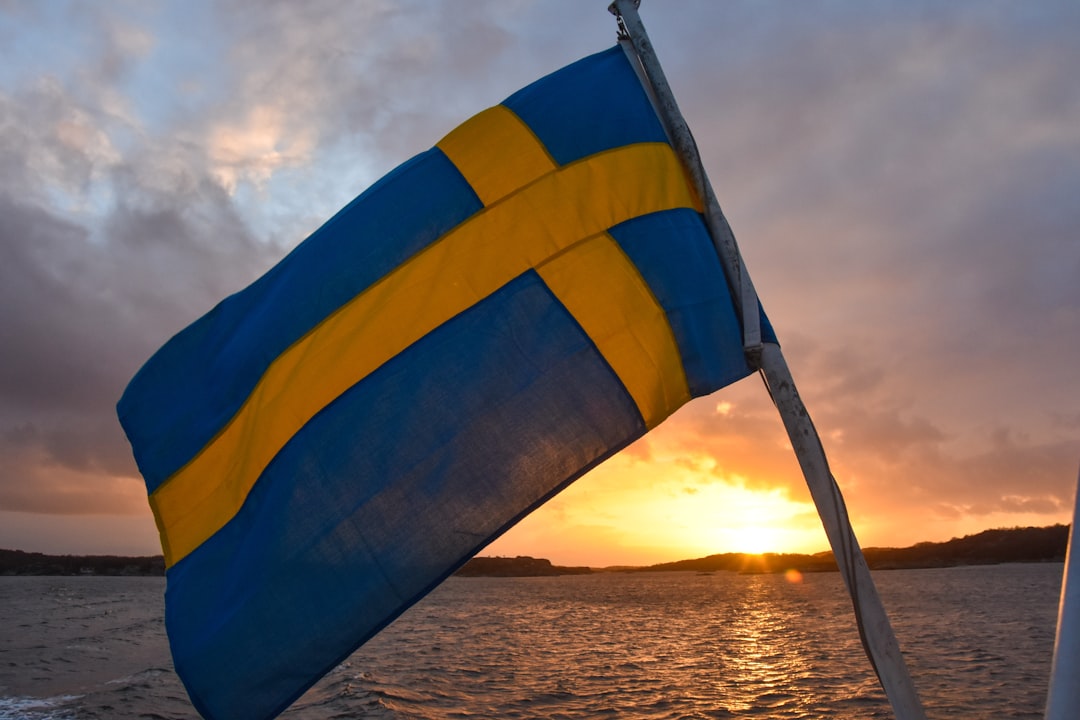 Swedish flag on boat, Sweden inflation analysis 0.4% disinflation