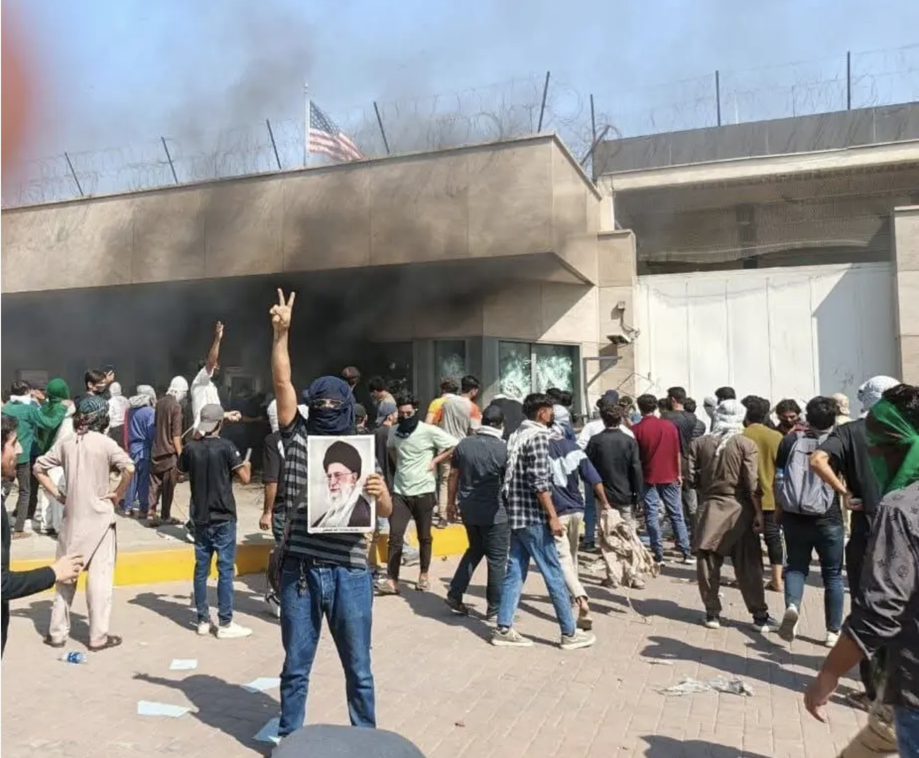 U.S. Consulate in Karachi with security personnel, indicating geopolitical risk