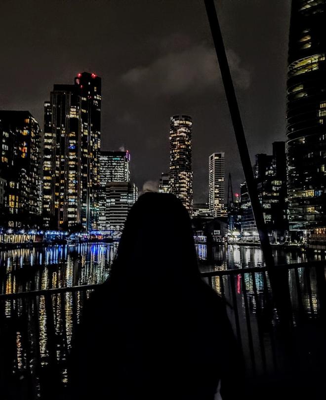 Australian Dollar and Swiss Franc currency notes visually representing the AUDCHF pair, against a backdrop showing market movements.