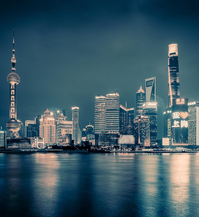 Bitcoin and XRP logos with a backdrop of financial charts illustrating market volatility