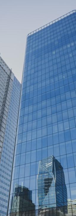 Global Dollar (USDG) stablecoin icon with a background of various cryptocurrency charts, symbolizing stability amidst volatility.