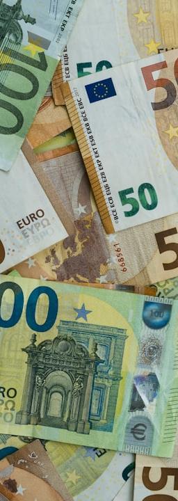 Gold bars and financial charts representing market consolidation