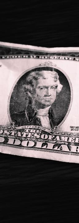 Mexican peso currency notes with a chart showing CPI data trend