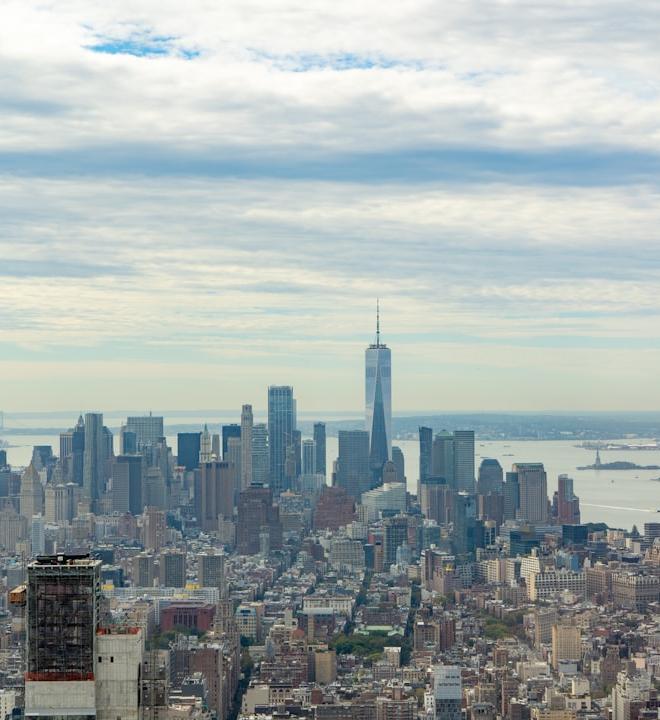 OFFICIAL TRUMP (TRUMP) crypto coin against a backdrop of global news headlines