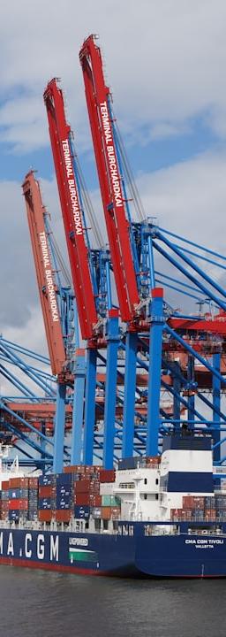 Graph showing converging bond yields from Europe's core and periphery markets, against a backdrop of a blurred trading floor, symbolizing periphery bond compression.