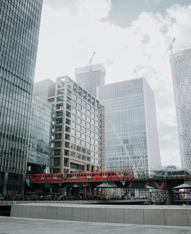 Steel industrial HRC coils in a warehouse with price analysis overlay