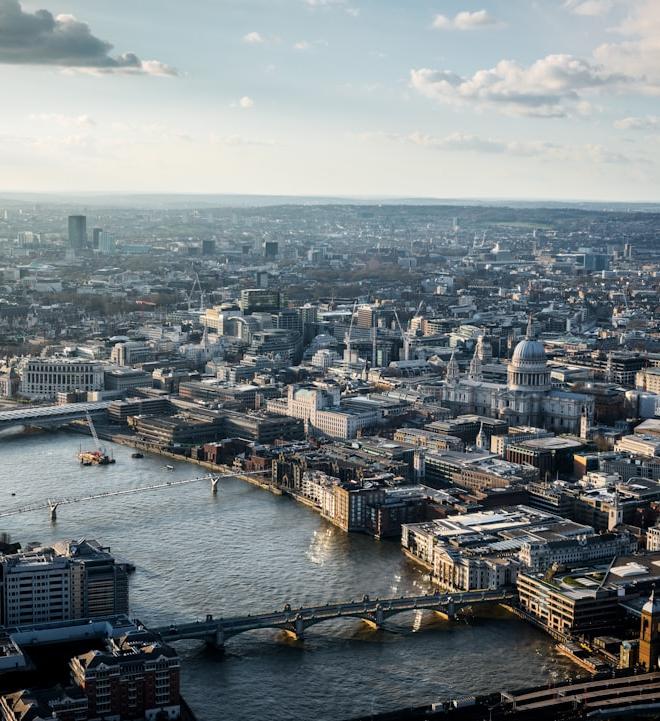 Steel coils stacked in a warehouse, representing the industrial commodity market and its price dynamics.