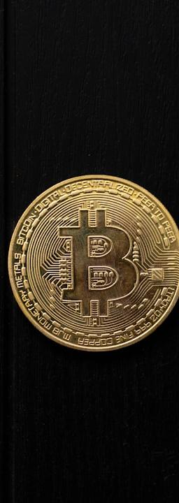 Bitcoin coin isolated on a black background.