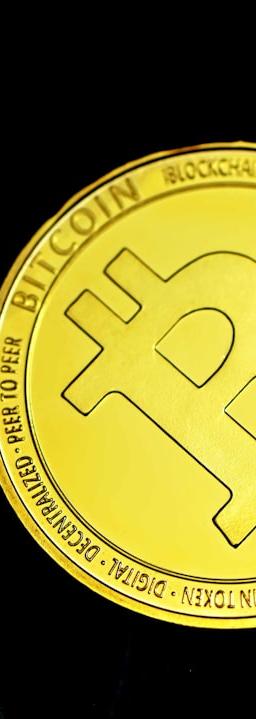 a bit coin sitting on top of a table