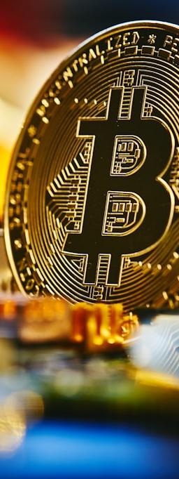 a bitcoin sitting on top of a computer chip