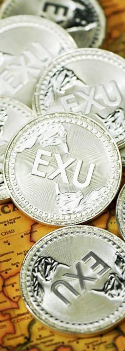 silver round coins on brown textile