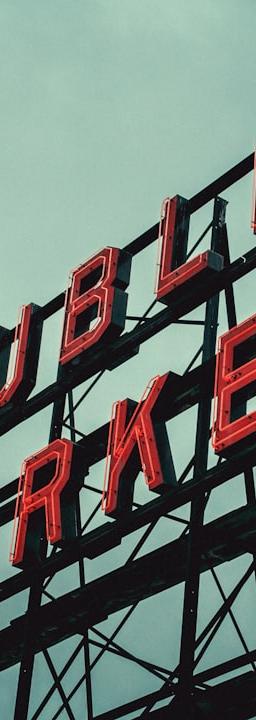 Red & white Kanji signage hints at global AI infrastructure capex, private vs public bonds.