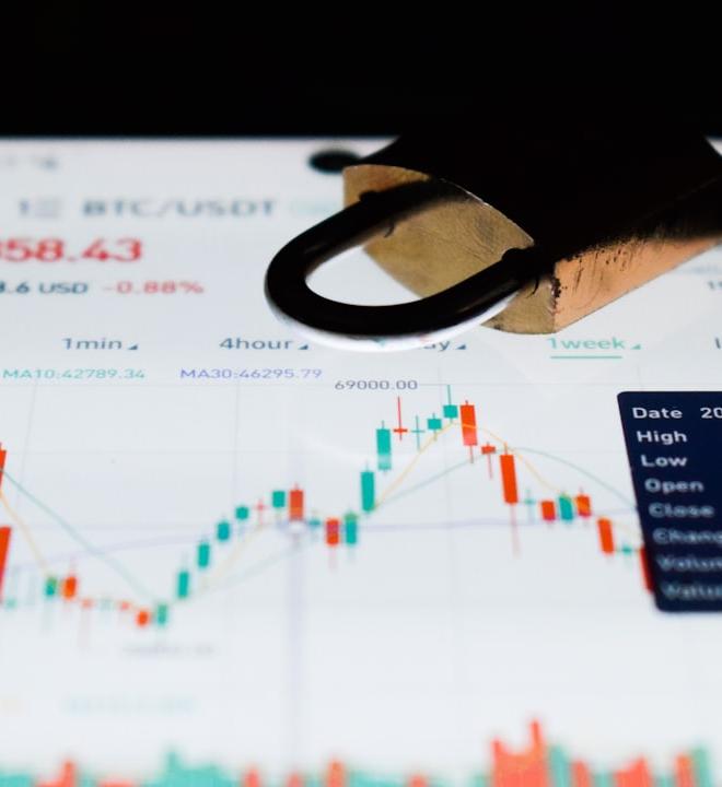 Dash crypto price chart on business card, navigating volatility.