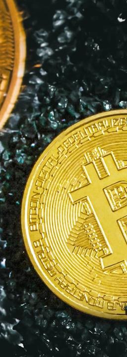 a bitcoin sitting next to a bitcoin on the ground