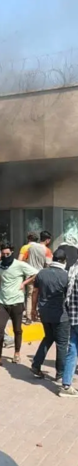 U.S. Consulate in Karachi with security personnel, indicating geopolitical risk