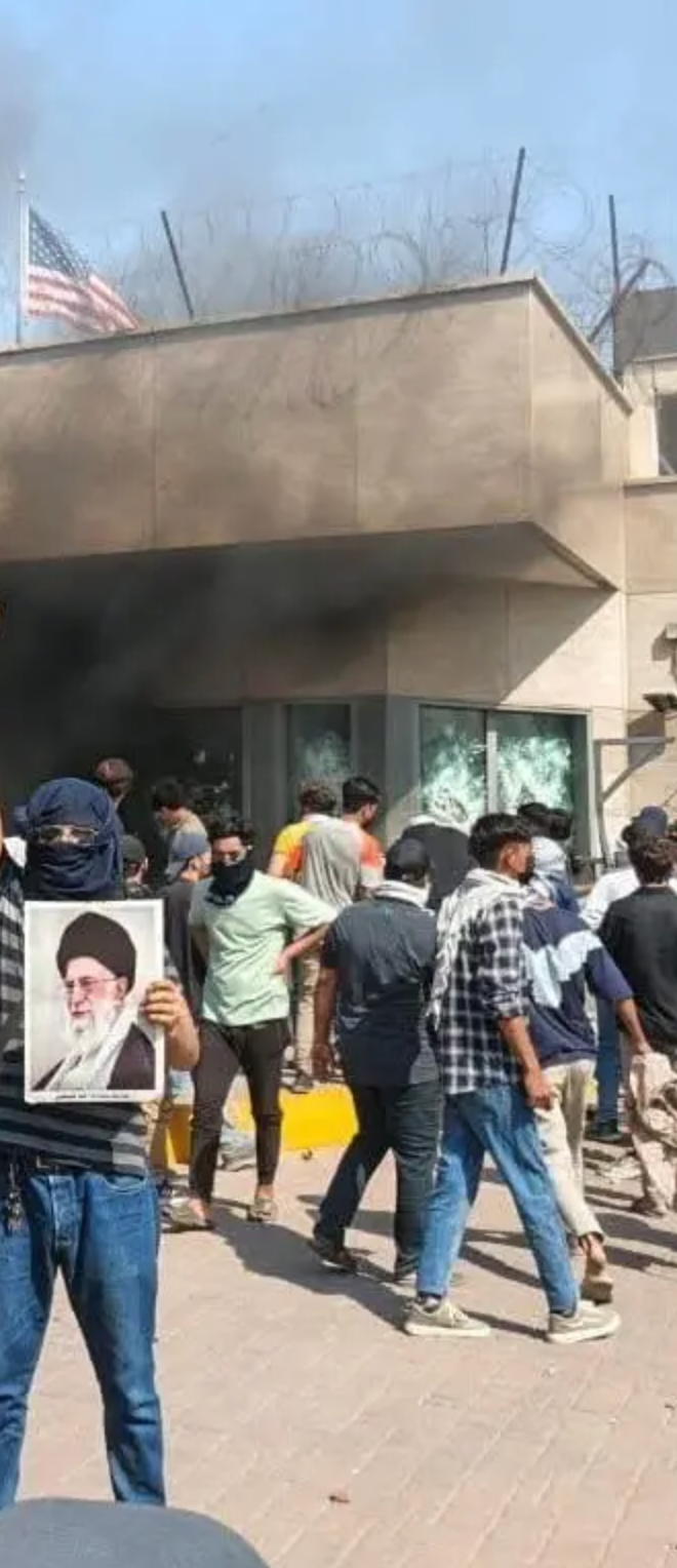 U.S. Consulate in Karachi with security personnel, indicating geopolitical risk